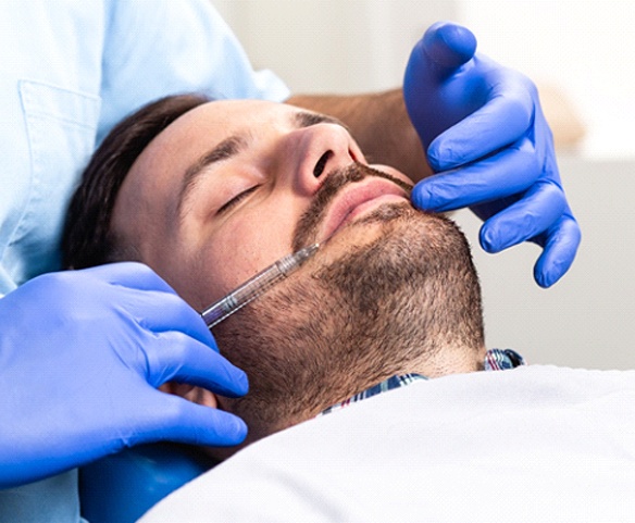Man resting in dental chair during dental appointment