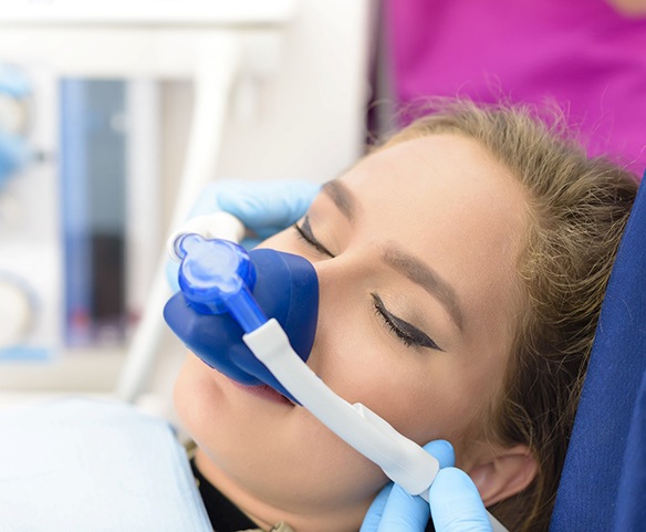 Female patient fitted with nitrous oxide sedation mask