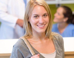 Smiling female patient at periodontal office