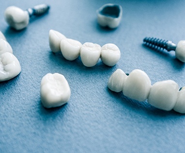 Different types of dental implants in Lincoln on blue background