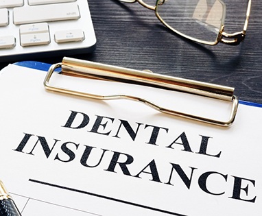 Dental insurance paperwork for the cost of dental implants in Lincoln