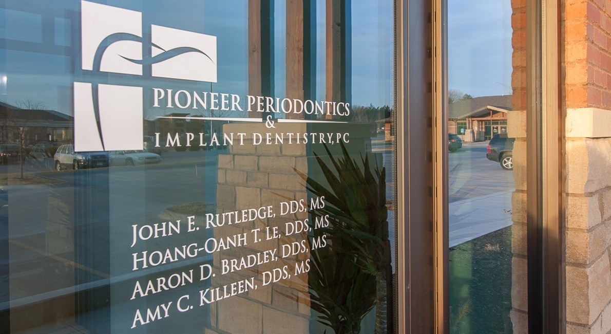 Pioneer Periodontics and Implant Dentistry sign on entry door