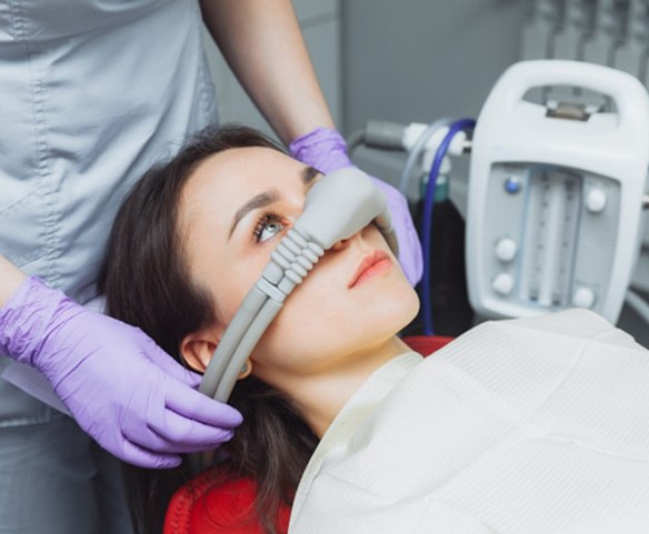 Female patient with mask for nitrous oxide sedation in Lincoln, NE 