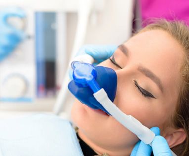Mask placed over patient’s nose for nitrous oxide sedation in Lincoln, NE 