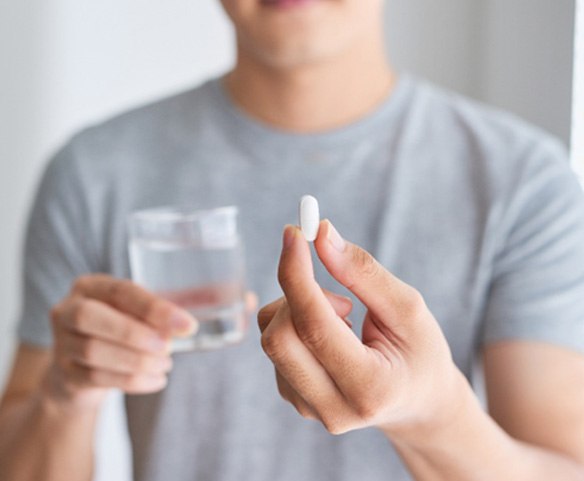 Patient about to take pill for oral conscious sedation in Lincoln, NE